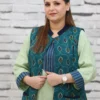 Woman wearing a sleeveless teal jacket with embroidered leaf motifs, crepe lining, and front pockets, styled over a light green kurta.