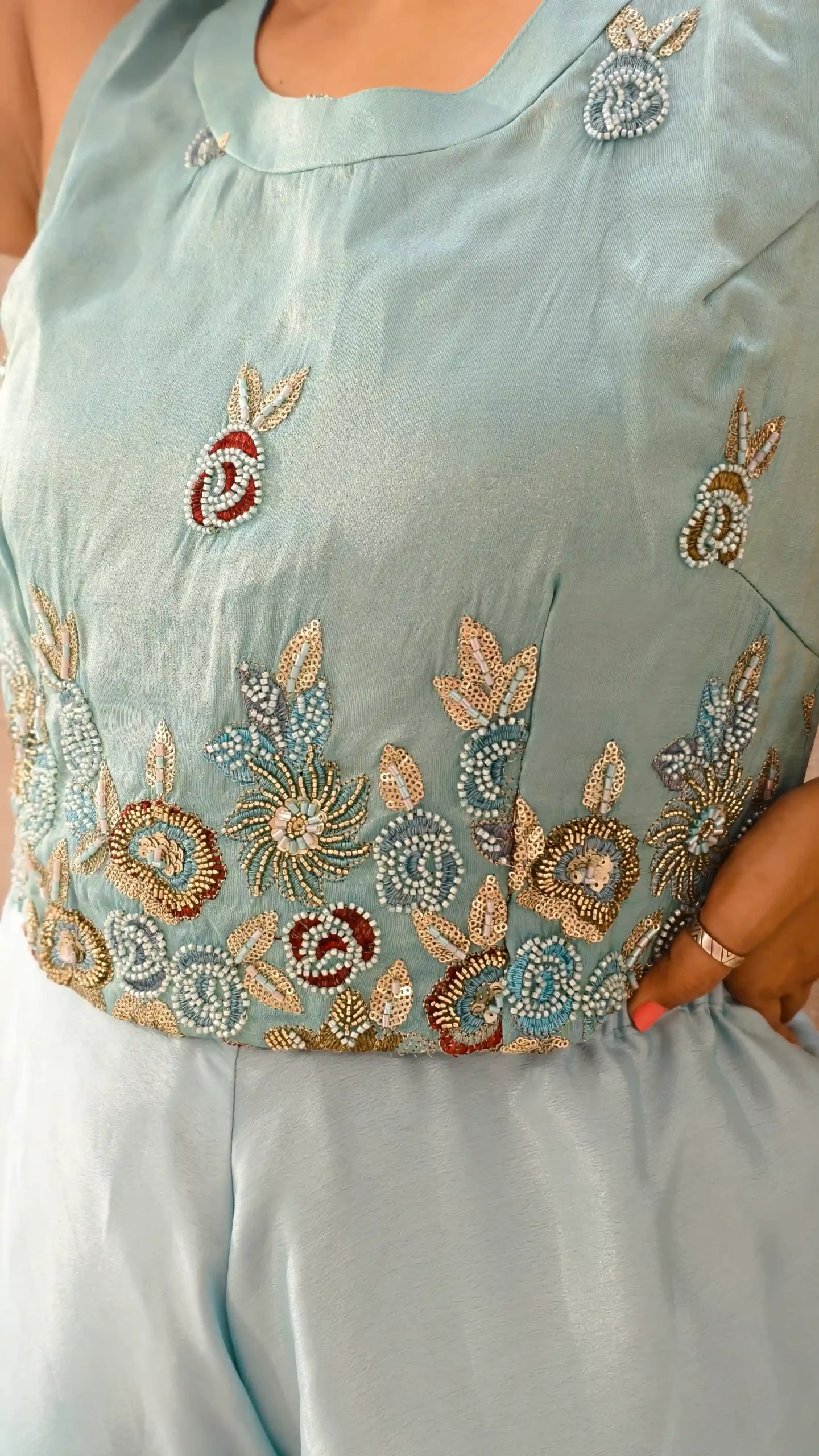 Model wearing peacock blue ombre satin co-ord set with hand-embroidered crop