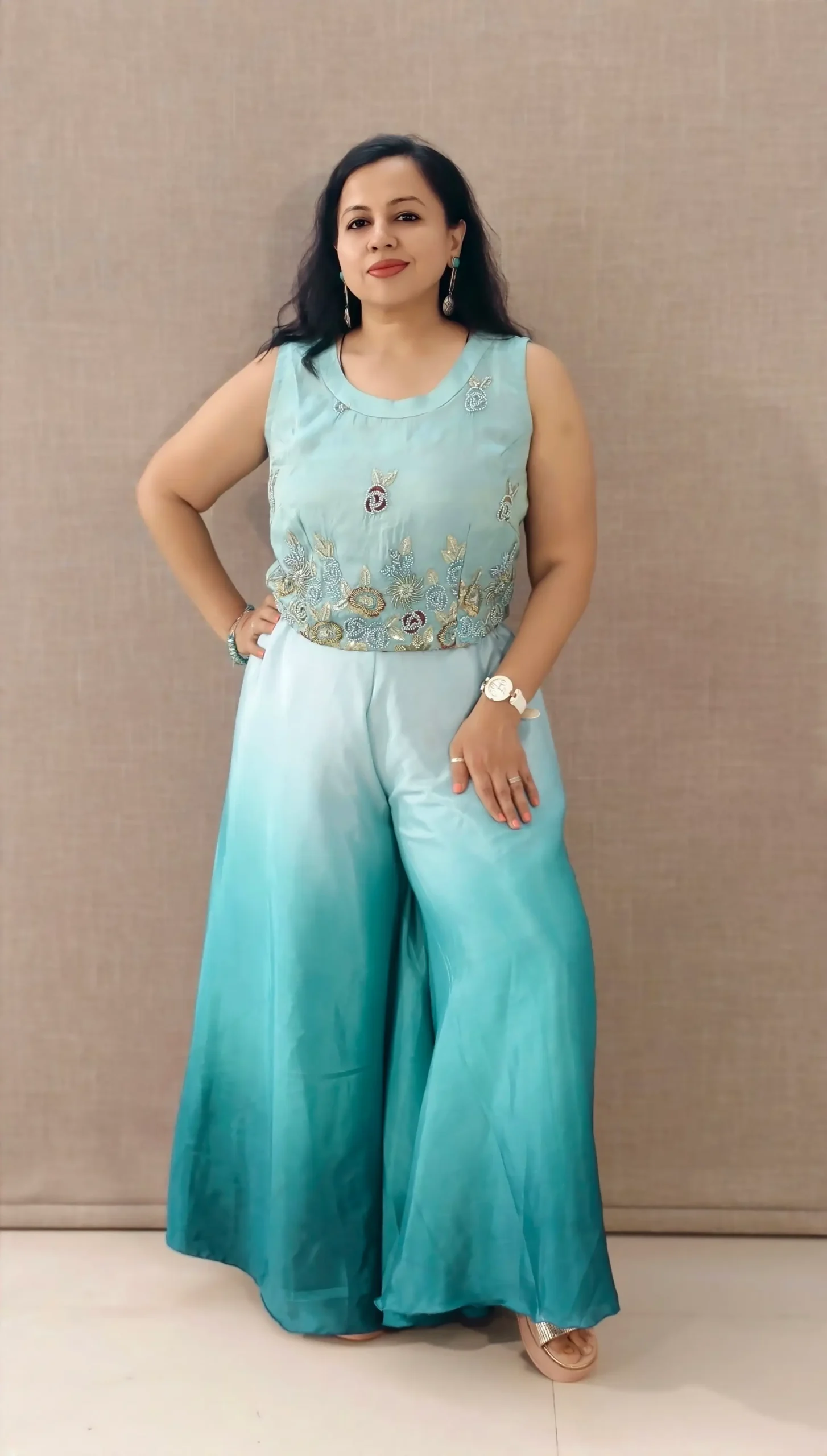 Model wearing peacock blue ombre satin co-ord set with hand-embroidered crop